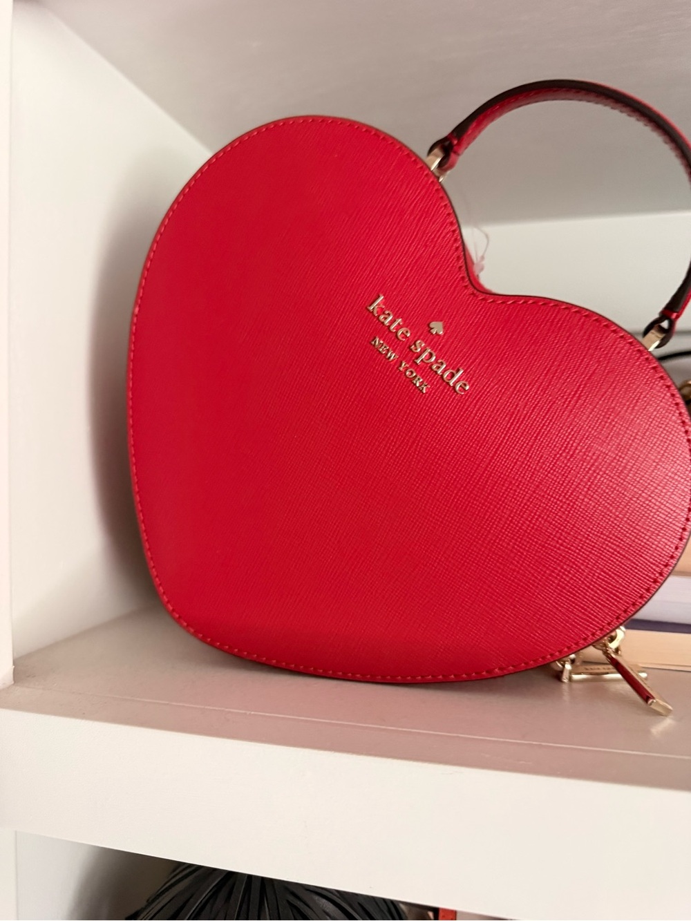 kate spade red heart-shaped mini crossbody bag with gold logo